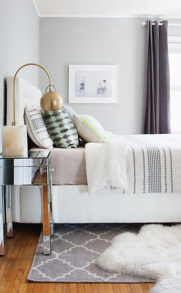 Bedroom with layered rugs